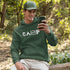 This cozy and comfortable Camping hoodie is the ultimate must-have for anyone who loves the great outdoors.